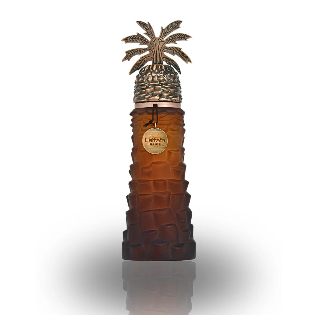 Luxurious Ajwaa EDP bottle by Lattafa Pride with a date-palm inspired design in a rich amber shade, exuding Arabian heritage and elegance.