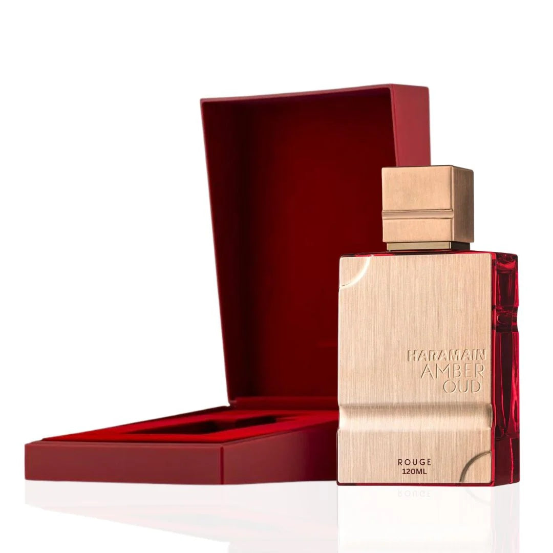 Open box showcasing Al Haramain Amber Oud Rouge Edition EDP Spray 120ML bottle with luxurious red and gold accents, highlighting elegance.