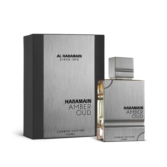Amber Oud Carbon Edition Eau De Parfum by Al Haramain, 100ml bottle displayed alongside its elegant packaging.