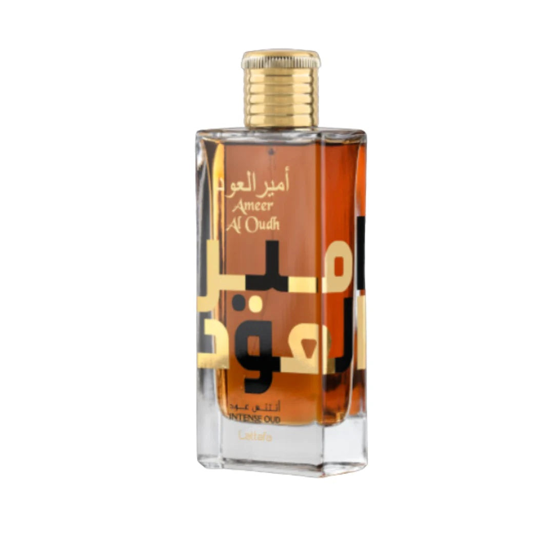 A close-up of the Ameer Al Oudh Intense Oud Eau De Parfum bottle by Lattafa, showcasing a sleek glass design with bold Arabic typography and a golden cap.