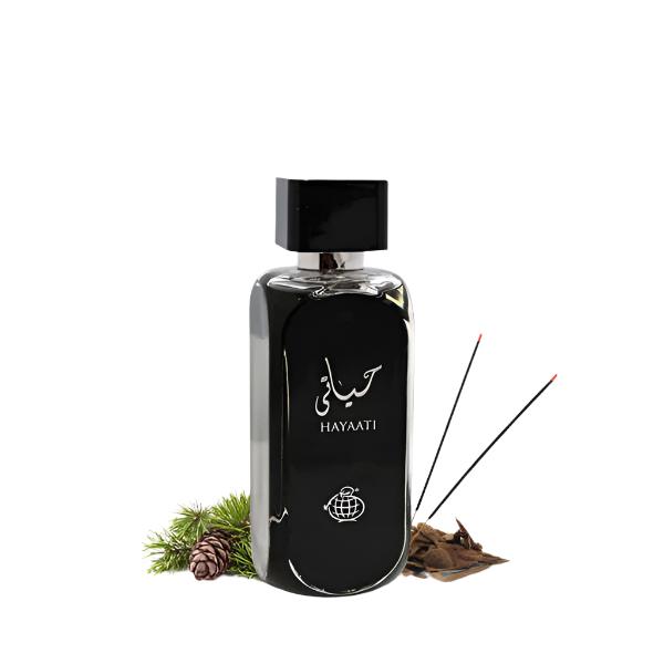 Lattafa Hayaati Black EDP bottle with incense sticks and pinecones, showcasing its warm and spicy fragrance notes.