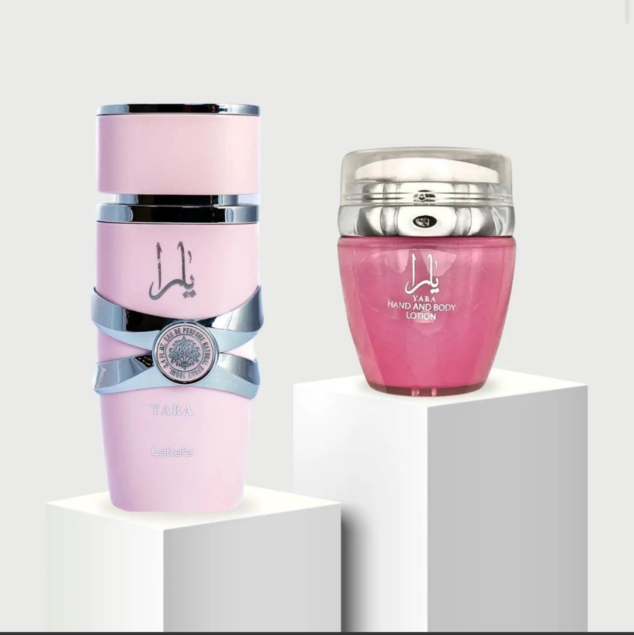 Yara Eau de Parfum 100ml bottle by Lattafa alongside Yara Hand & Body Lotion 45ml by Ard Al Zaafaran, showcased on white platforms.