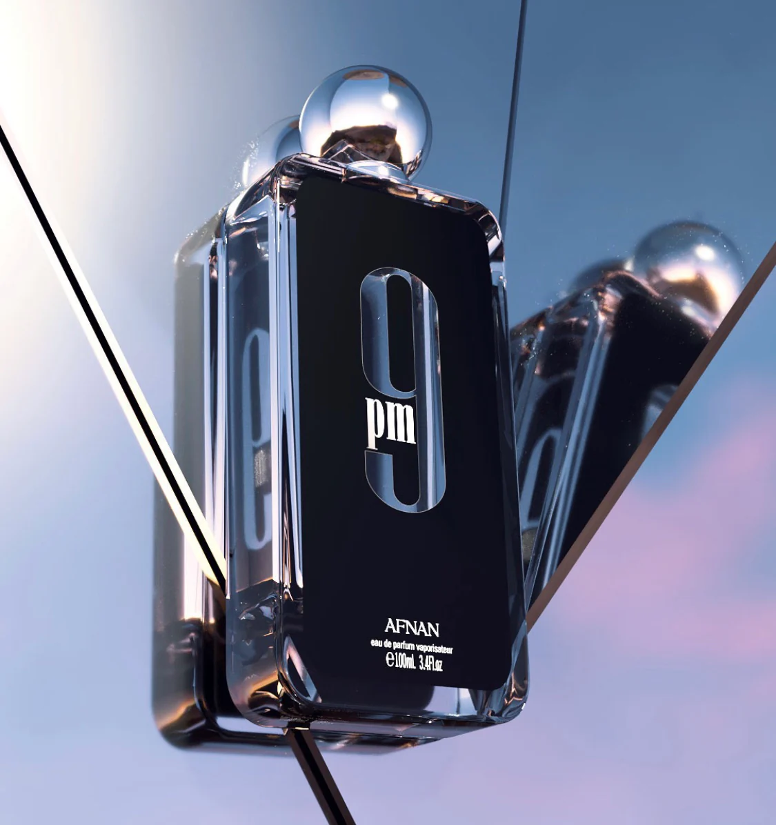 Afnan 9pm Perfume displayed against reflective mirrors - Sleek and modern unisex fragrance.