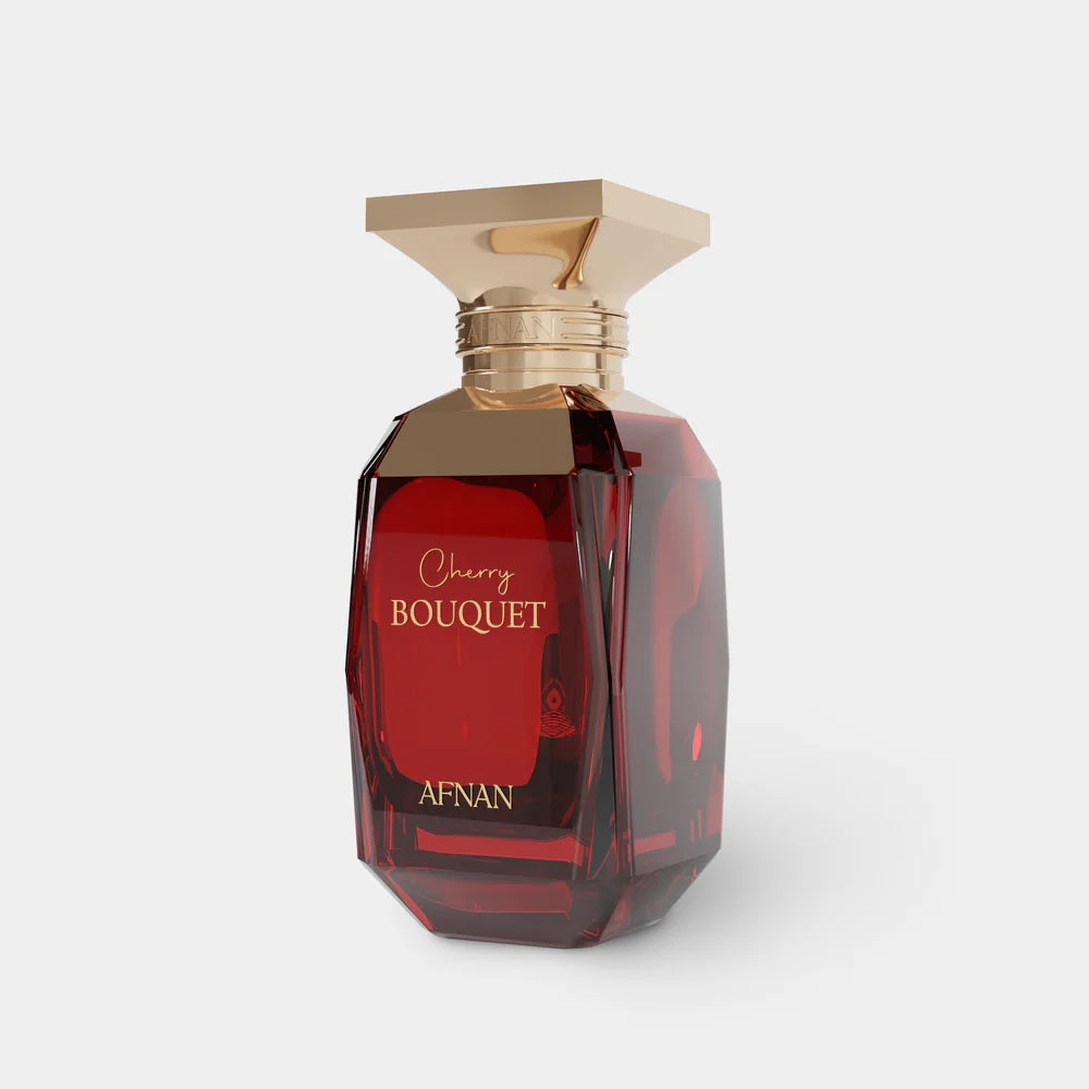 Afnan Cherry Bouquet Eau De Parfum bottle in a stunning deep red glass design with gold detailing, angled to showcase its luxurious aesthetic.