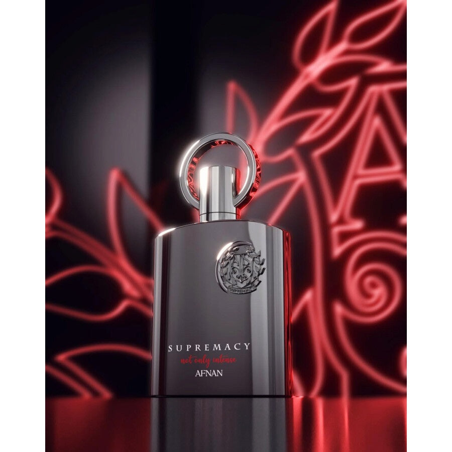 Afnan Supremacy Not Only Intense ExDP – A luxurious, long-lasting men's fragrance displayed with an eye-catching red neon backdrop.