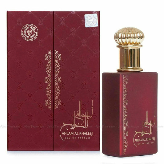 Ahlam Al Khaleej Eau De Parfum by Ard Al Zaafaran, showcasing the sophisticated deep red and gold bottle alongside its matching embossed packaging.