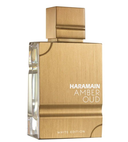 Close-up of the Al Haramain Amber Oud White Edition perfume bottle, highlighting its sleek gold finish and sophisticated design.