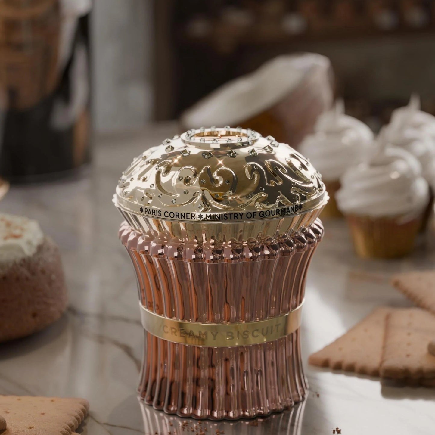 Creamy Biscuit perfume by Paris Corner surrounded by cupcakes and biscuits, showcasing its sweet dessert-inspired scent.