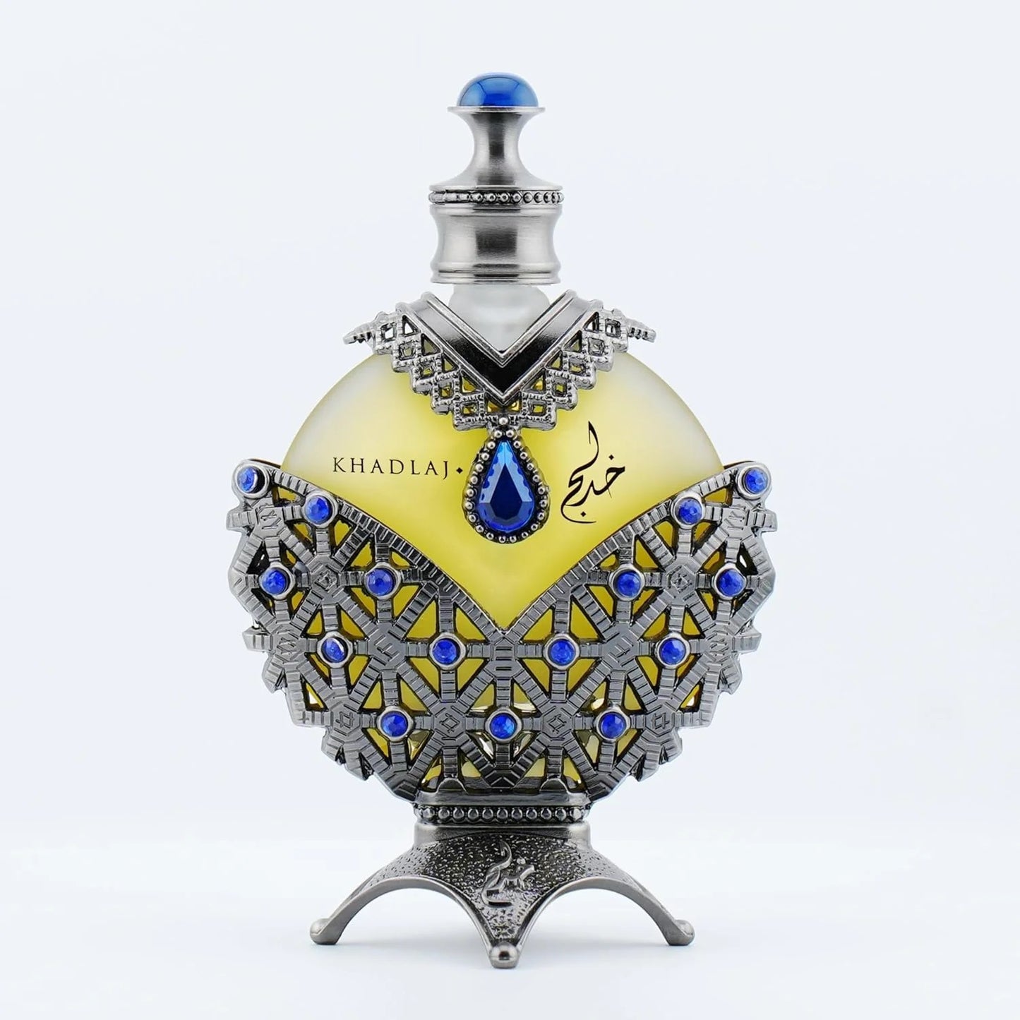 Close-up of Hareem Al Sultan Blue Antique Perfume Oil by Khadlaj in an intricately designed silver bottle adorned with blue accents.