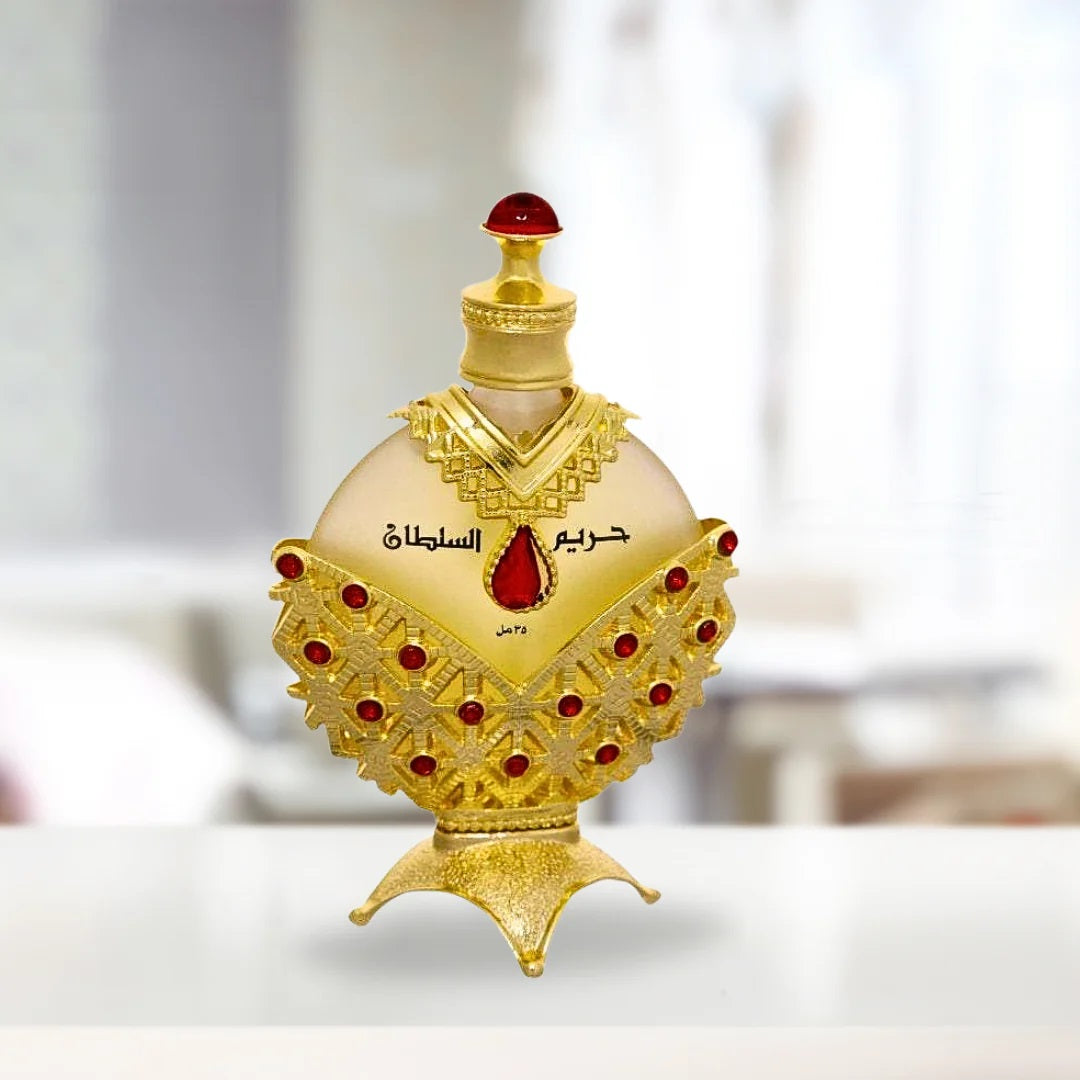 Hareem Al Sultan Gold Perfume Oil by Khadlaj, 35ML, featuring a luxurious gold bottle with intricate red and gold embellishments.