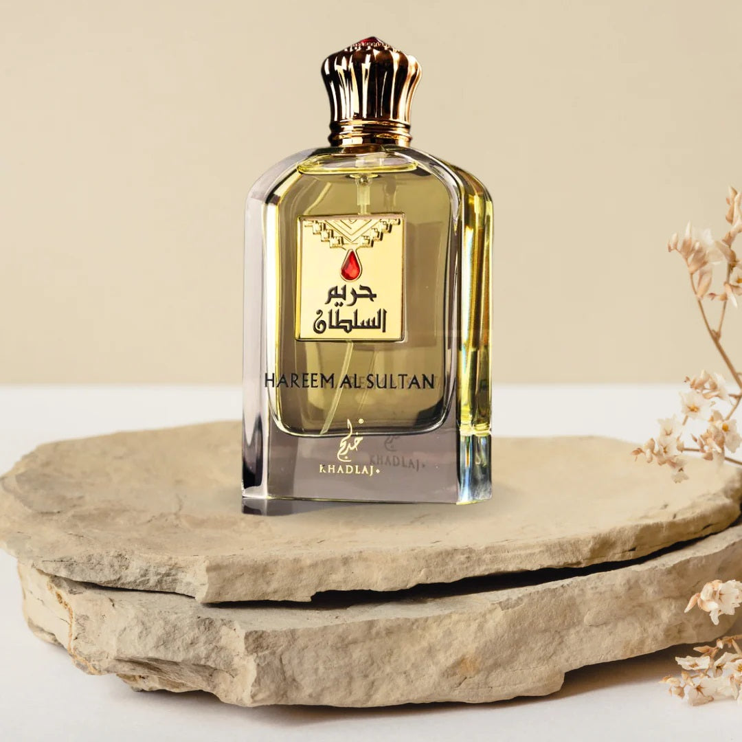 Hareem Al Sultan perfume by Khadlaj placed elegantly on stone slabs, showcasing its luxurious bottle with golden accents.