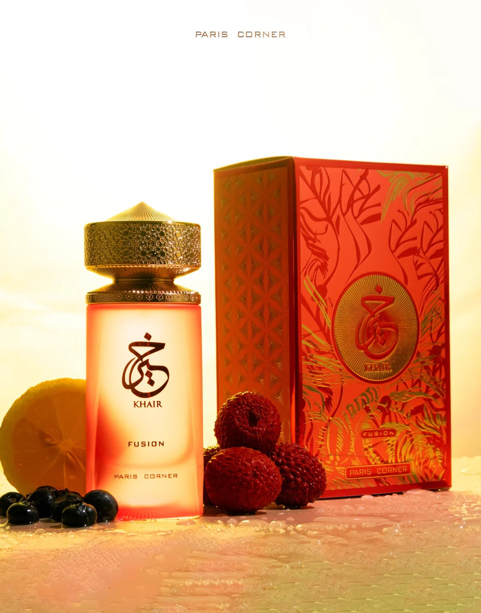 Khair Fusion Lyche Paris Corner perfume bottle and box set with exotic fruits on a glistening surface