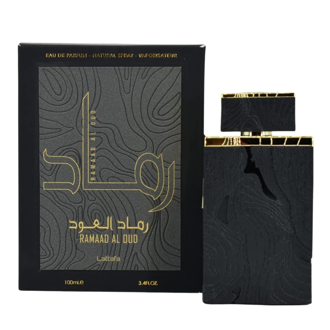 Ramaad Al Oud Eau De Parfum by Lattafa – 100ML unisex fragrance featuring a luxurious black textured bottle with gold detailing, presented with its premium packaging.