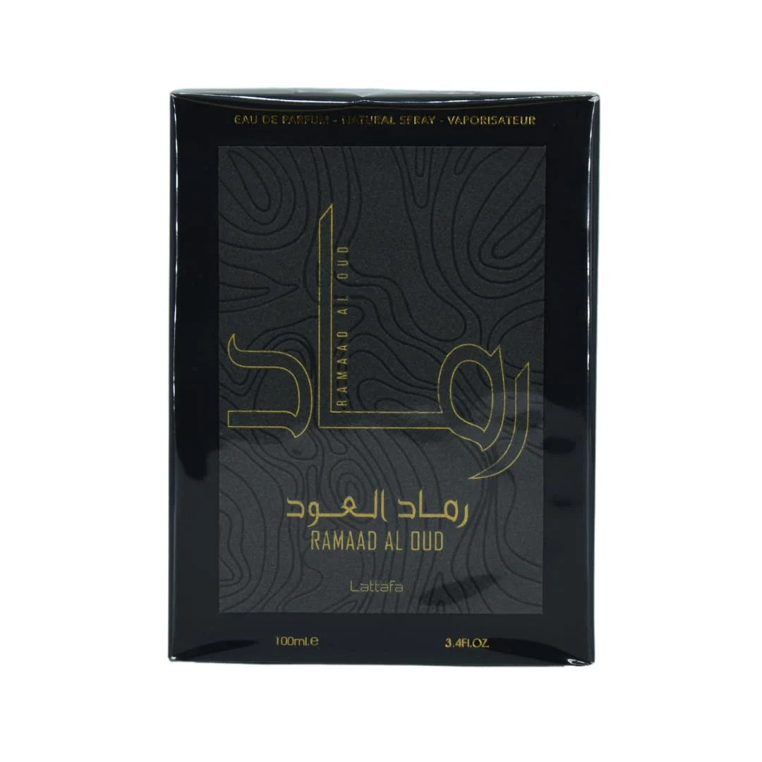 Ramaad Al Oud EDP 100ML by Lattafa – Elegant black and gold packaging with Arabic calligraphy design, embodying luxury and sophistication.