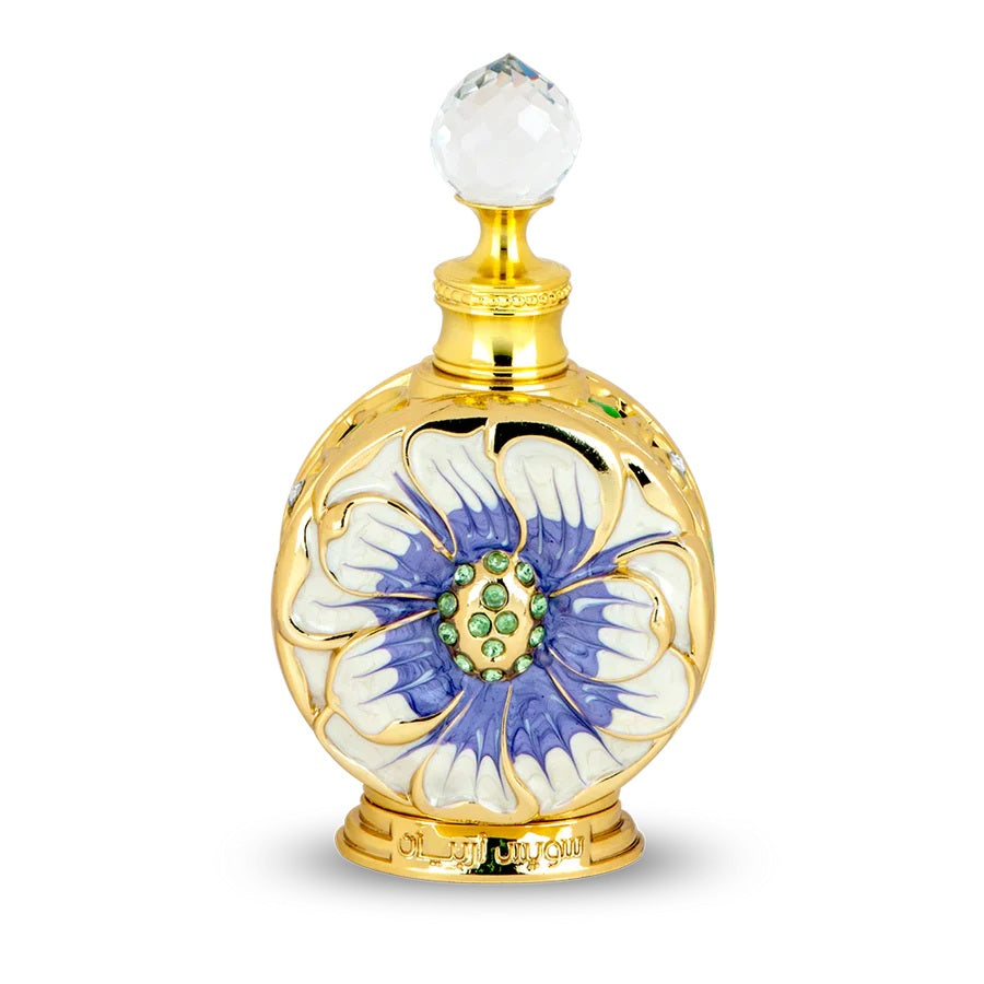 Layali perfume bottle by Swiss Arabian featuring a luxurious golden design with a violet and white floral motif, adorned with a crystal cap.
