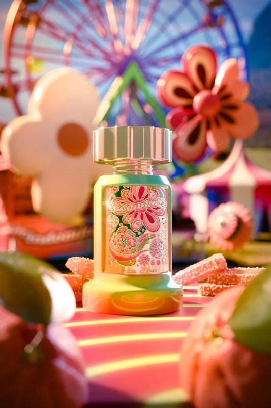 Indomitable Perfume by Paris Corner displayed in a carnival-themed setting with colorful floral and candy accents