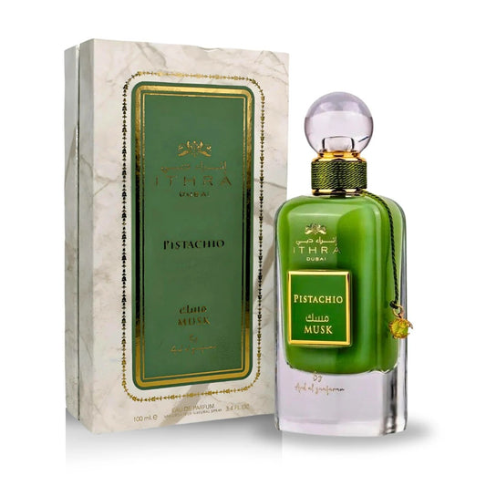 Pistachio Musk Eau de Parfum 100ML bottle alongside its elegant marble-patterned packaging, part of the Ithra Dubai Collection by Ard Al Zaafaran.