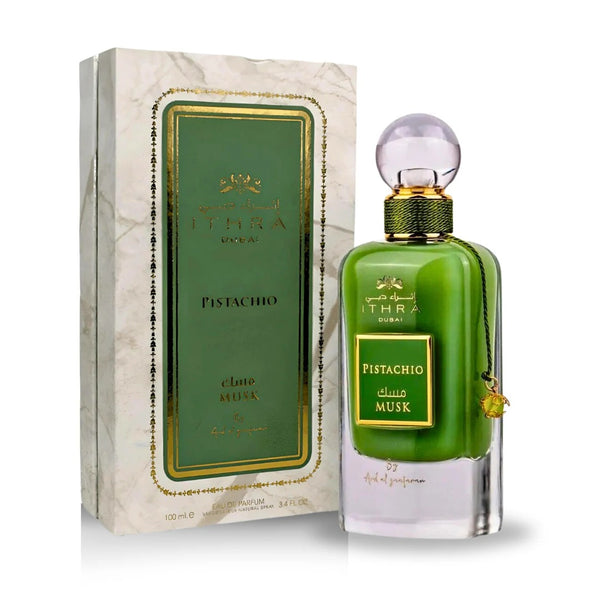Pistachio Musk Eau de Parfum 100ML bottle alongside its elegant marble-patterned packaging, part of the Ithra Dubai Collection by Ard Al Zaafaran.