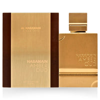Al Haramain Amber Oud Gold Edition EDP 100ML with its luxurious golden packaging, showcasing a sleek and elegant design.