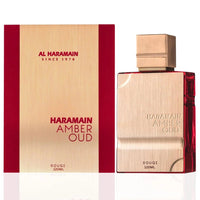 Al Haramain Amber Oud Rouge Edition EDP Spray 120ML bottle and packaging. The gold and red design conveys luxury and sophistication.