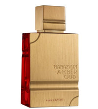 A close-up view of Al Haramain Amber Oud Ruby Edition bottle, showcasing its elegant gold finish and striking ruby red detail.