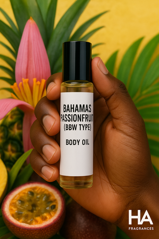 A bottle of Bahamas Passionfruit (BBW Type) Body Oil held by a dark-skinned hand, surrounded by banana flowers, pineapple leaves, and passionfruit, with the HA Fragrances logo in the corner.