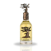 A close-up view of the Eternal Oud Eau De Parfum bottle by Lattafa Pride, featuring a unique tree-inspired bronze design and luxurious golden fragrance.