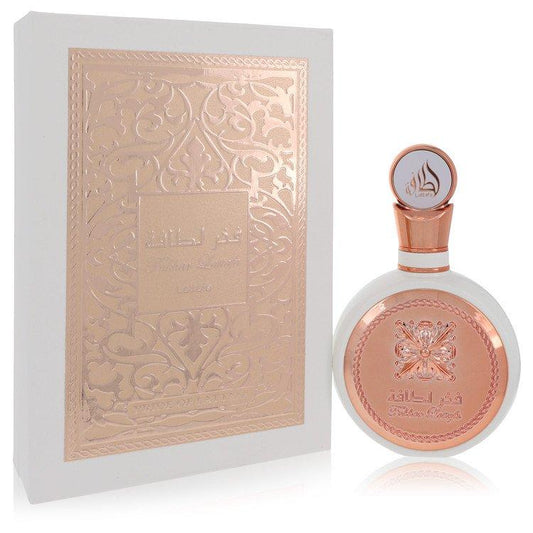Fakhar by Lattafa Eau de Parfum 3.4oz, showcasing a stunning rose gold and white bottle with its matching ornate packaging.