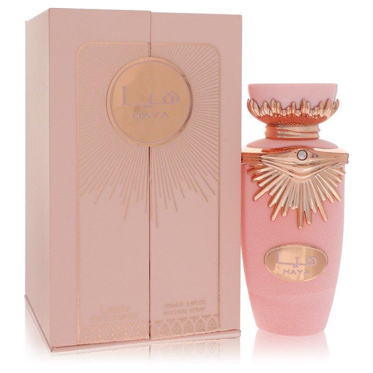 Haya by Lattafa Perfume in an elegant pink bottle with a rose gold decorative top, alongside its luxurious pink packaging box, 100ml Eau de Parfum Spray for Women.