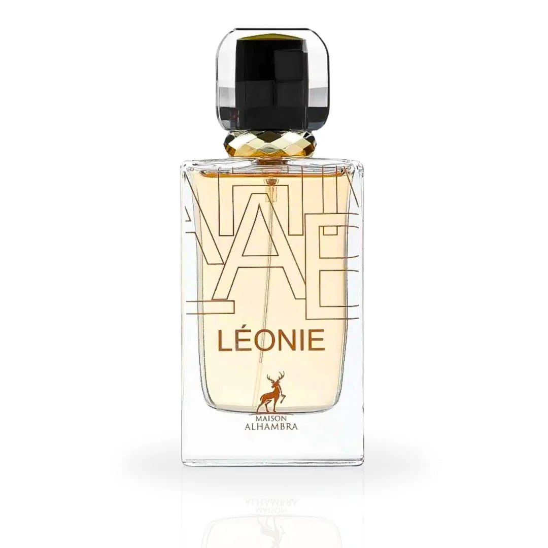 A close-up of the Léonie Eau De Parfum bottle by Maison Alhambra, showcasing its sleek glass design with golden accents and a luxurious black cap.