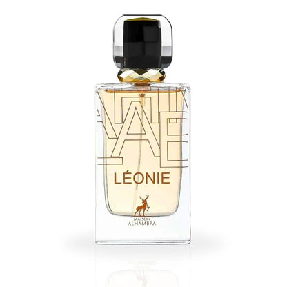 A close-up of the Léonie Eau De Parfum bottle by Maison Alhambra, showcasing its sleek glass design with golden accents and a luxurious black cap.