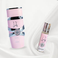 Lattafa Yara perfume set featuring a soft pink spray bottles with silver accents and a matching roo-on bottle, place on white fabric background for an elegant presentation.
