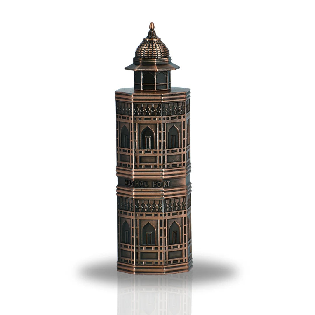 A detailed view of the Mughal Fort Eau De Parfum bottle by Lattafa, featuring a unique architectural design inspired by traditional Mughal forts in a bronze finish.