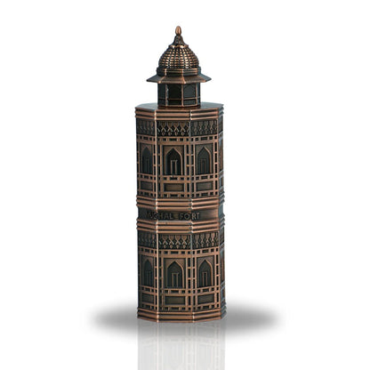 A detailed view of the Mughal Fort Eau De Parfum bottle by Lattafa, featuring a unique architectural design inspired by traditional Mughal forts in a bronze finish.