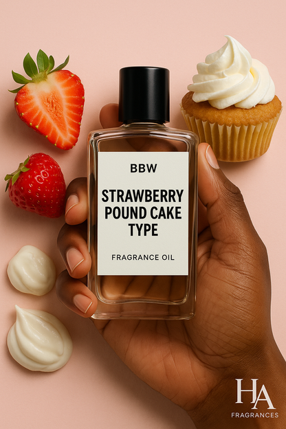 A bottle of Strawberry Pound Cake (BBW Type) Body Oil held by a dark-skinned hand, surrounded by ripe strawberries, frosted cupcakes, and swirls of whipped cream, with the HA Fragrances logo in the corner.