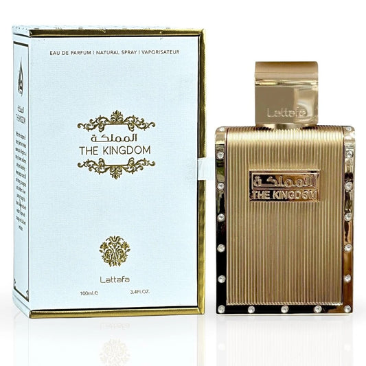 The Kingdom Eau De Parfum by Lattafa displayed with its elegant white and gold packaging and a luxurious gold bottle adorned with crystal accents.