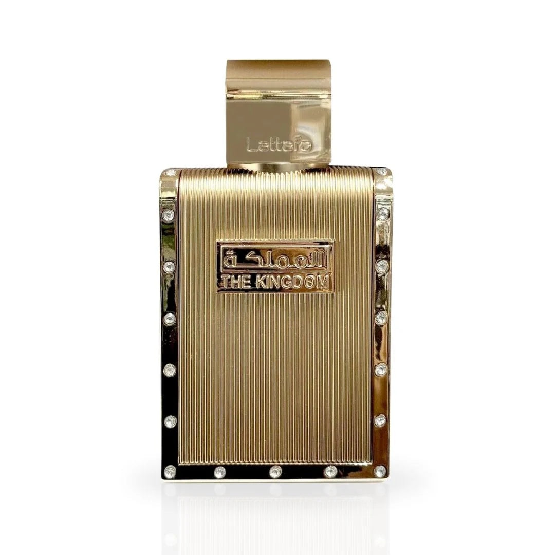 A close-up of The Kingdom Eau De Parfum bottle by Lattafa, featuring a luxurious gold design with sleek lines and crystal accents, exuding elegance and sophistication.