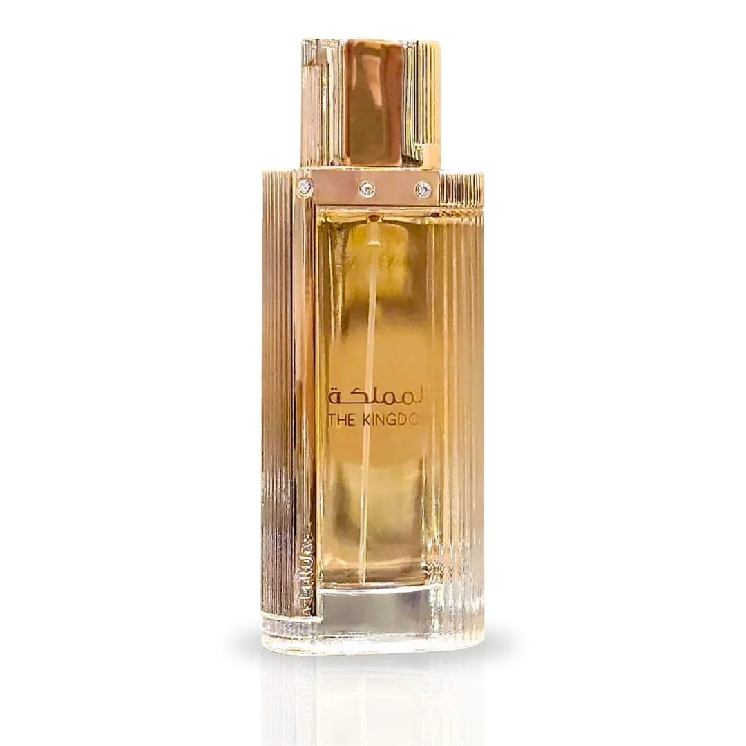 A close-up of The Kingdom for Women Eau De Parfum bottle by Lattafa, featuring a sleek glass design with gold accents and an elegant, luxurious aesthetic.