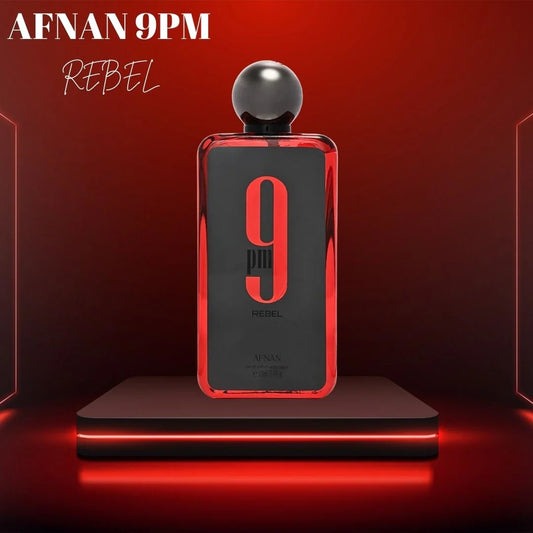 Afnan 9PM Rebel Eau De Parfum bottle displayed on a modern red-lit platform, showcasing its bold and luxurious design.