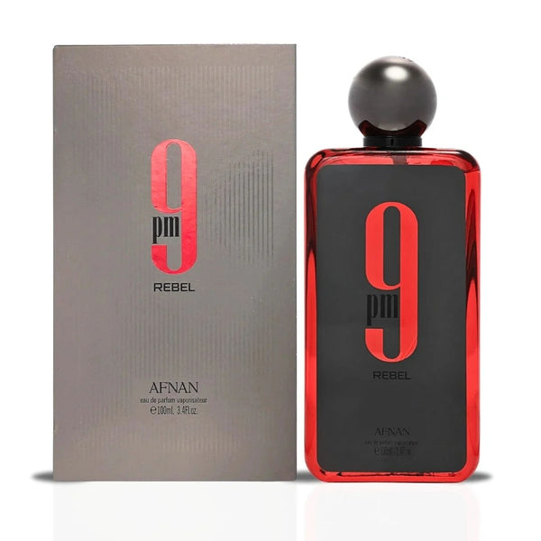 Afnan 9PM Rebel Eau De Parfum bottle placed alongside its sleek, modern packaging, highlighting its premium design and branding.