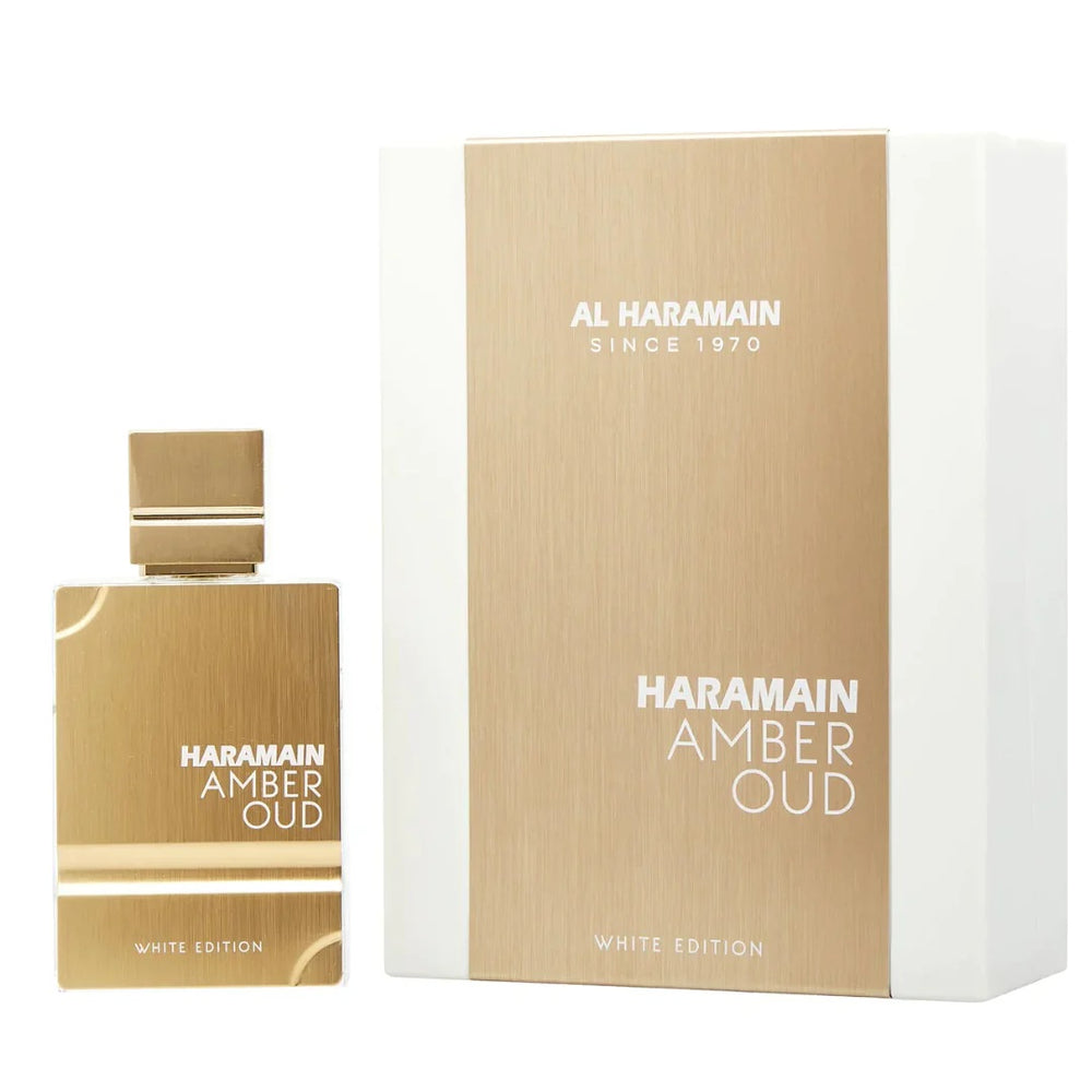Al Haramain Amber Oud White Edition box and bottle displayed together, showcasing the elegant gold and white packaging design.
