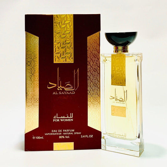 Al Sayaad for Women Eau De Parfum 100ML by Ard Al Zaafaran, showcasing the luxurious gold-detailed bottle alongside the bold red and gold box.