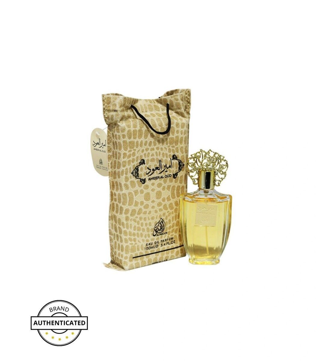 Ameer Al Oud by Al Fanoon 3.4 FL OZ Eau de Parfum featuring a golden perfume bottle with an ornate cap and a luxurious pouch-style packaging.