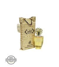 Ameer Al Oud by Al Fanoon 3.4 FL OZ Eau de Parfum featuring a golden perfume bottle with an ornate cap and a luxurious pouch-style packaging.