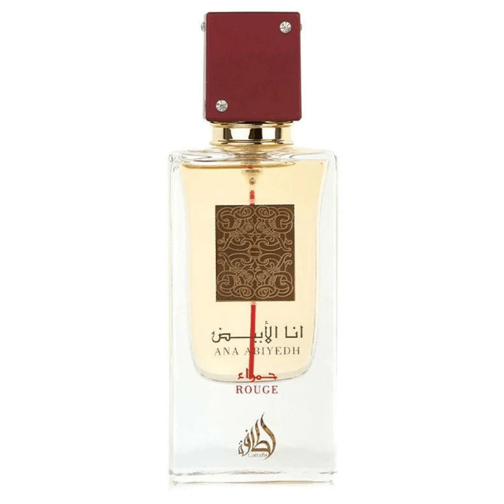 Ana Abiyedh Rouge Eau De Parfum by Lattafa, showcasing a stylish clear bottle with intricate gold designs and a bold red cap.