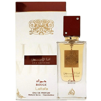 Ana Abiyedh Rouge Eau De Parfum by Lattafa, featuring a sophisticated clear bottle with gold detailing and a matching white and red box.