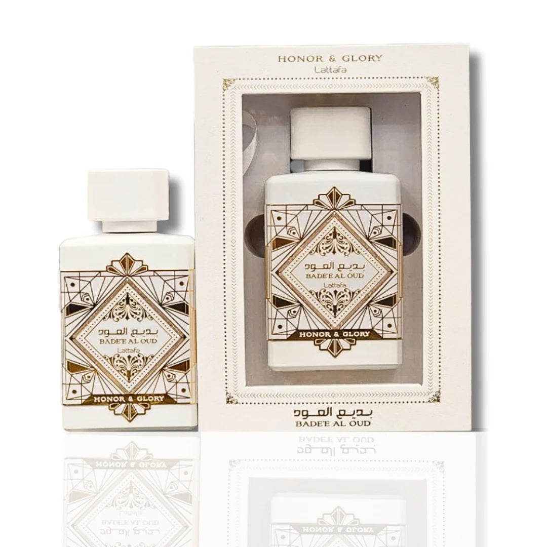 Bade’e Al Oud Honor & Glory Eau De Parfum by Lattafa, featuring an elegant white bottle with intricate gold detailing, paired with matching luxurious packaging.