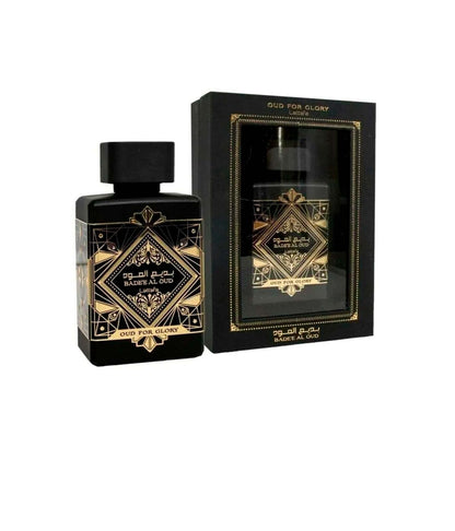 Oud For Glory Bade’e Al Oud by Lattafa, showcasing the elegant black and gold perfume bottle alongside its luxurious packaging.