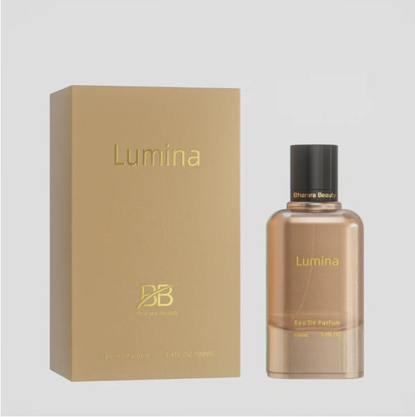Bharara Beauty Lumina Women Eau De Parfum 3.4oz gold bottle with matching luxury box packaging displayed on neutral background.
