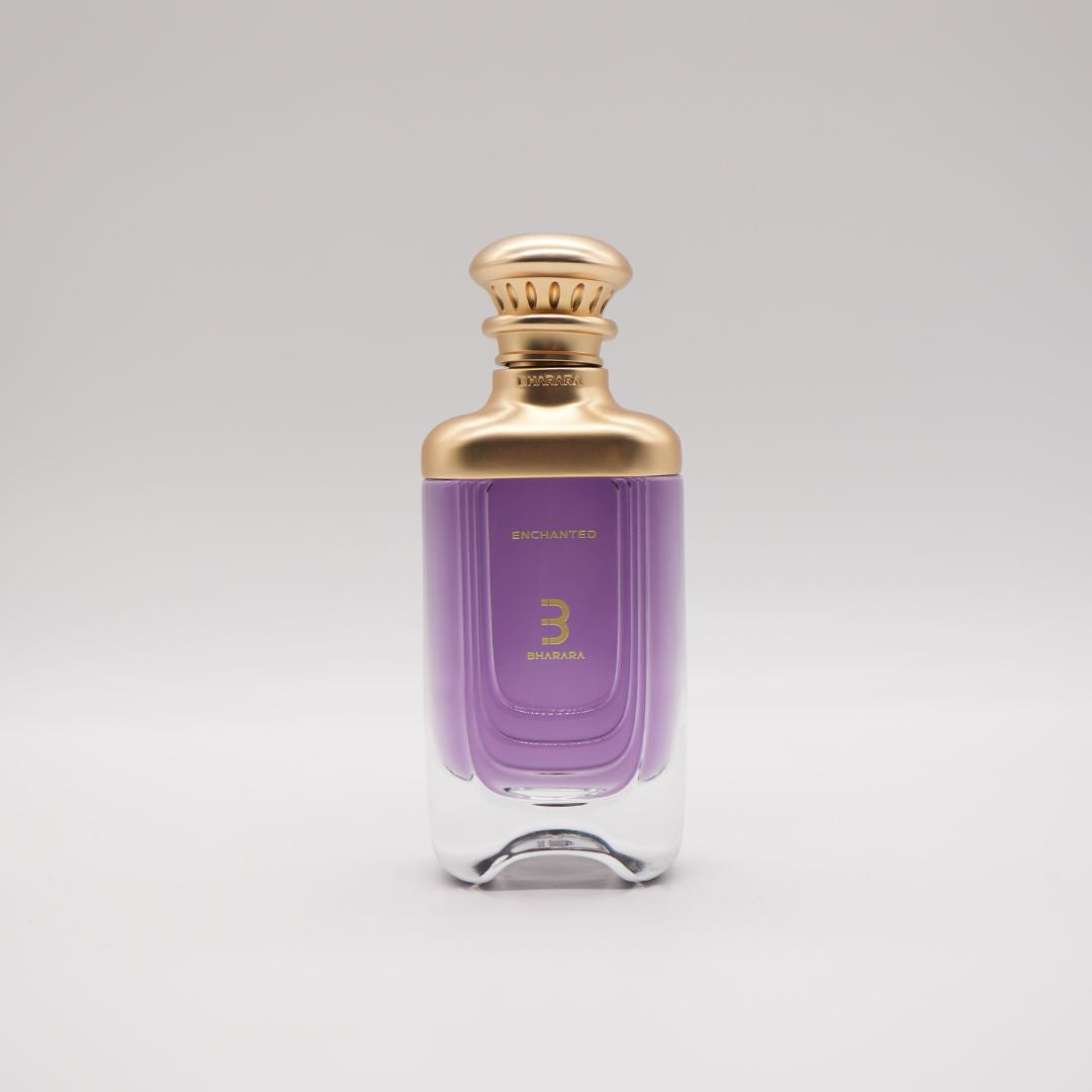 Bharara Enchanted 3.4 oz Eau De Parfum bottle – elegant unisex fragrance with purple liquid and gold cap.
